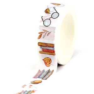 May include: Washi tape roll with a watercolour design of books, glasses, and autumn leaves. The white tape has a repeating pattern of literary and seasonal elements. Ideal for scrapbooking and craft projects.