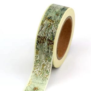 May include: Decorative washi tape roll featuring a vintage map design in shades of green, brown, and cream. The tape is wrapped around a brown cardboard core, ideal for scrapbooking, journaling, and craft projects.