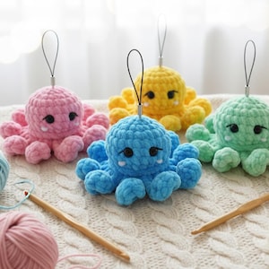 May include: A collection of handmade crochet octopus toys in pink, yellow, blue, and green. Each plushie has black eyes and a loop for hanging. Yarn and crochet hooks are also visible, suggesting a crafting theme.