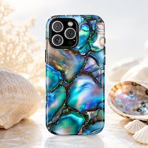 May include: A smartphone case featuring a vibrant, iridescent abalone shell pattern with deep blues, teals, and purples. The design mimics a mosaic of polished shell fragments separated by dark, thin, vein-like lines across the entire surface.