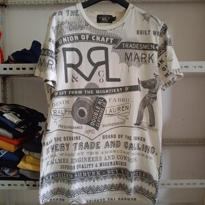 May include: White short-sleeved t-shirt with a printed design. The shirt features black text and graphics, including the letters "R" and "L" and the words "Union of Craft" and "Every Trade and Calling".