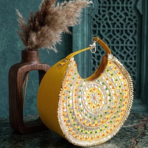 Indian bridal half moon clutch bag with colorful embroidery