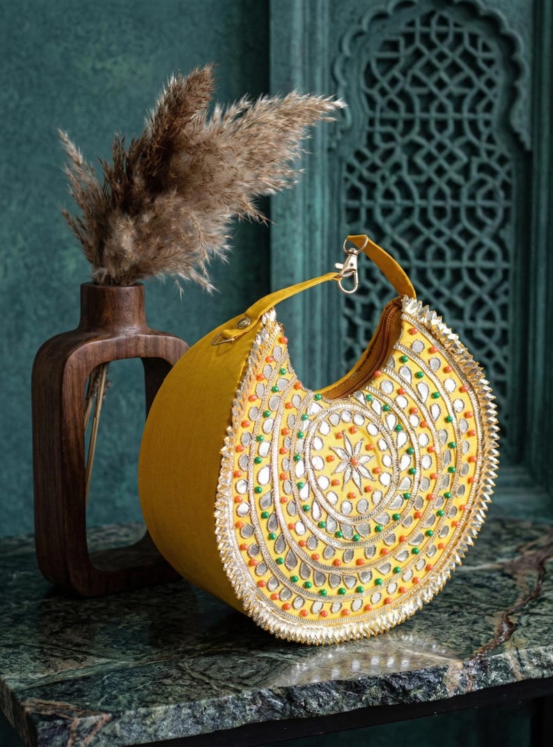 Indian bridal half moon clutch bag with colorful embroidery