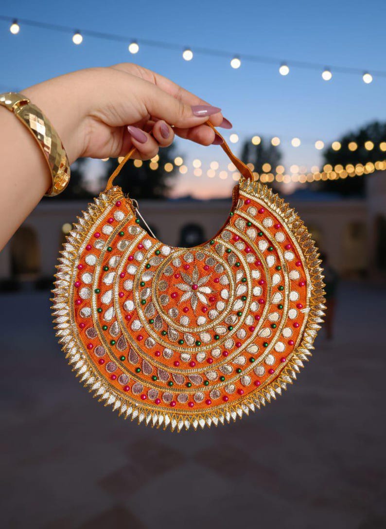 Hand embroidered Indian potli bag with gotta patti work and floral motif
