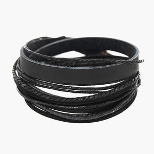 May include: A black leather wrap bracelet with multiple strands of varying textures. The bracelet features a wide, flat leather band and several thinner, braided and corded strands, all in black. The design is simple and versatile.