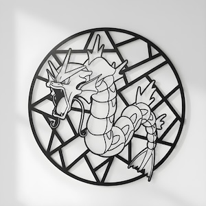May include: Black metal wall art featuring a stylized depiction of a serpentine creature with an open mouth, set within a geometric circular frame. The artwork is a decorative piece, suitable for interior decor.