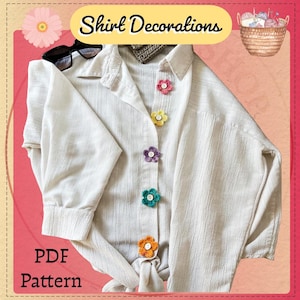 以下が含まれることがあります： クリーム色のボタンダウンシャツに、カラフルなかぎ針編みの花のボタンが付いています。「Shirt Decorations」と「PDF Pattern」の文字が画像に表示されています。サングラスが襟の上にあります。毛糸のバスケットが右上隅にあります。