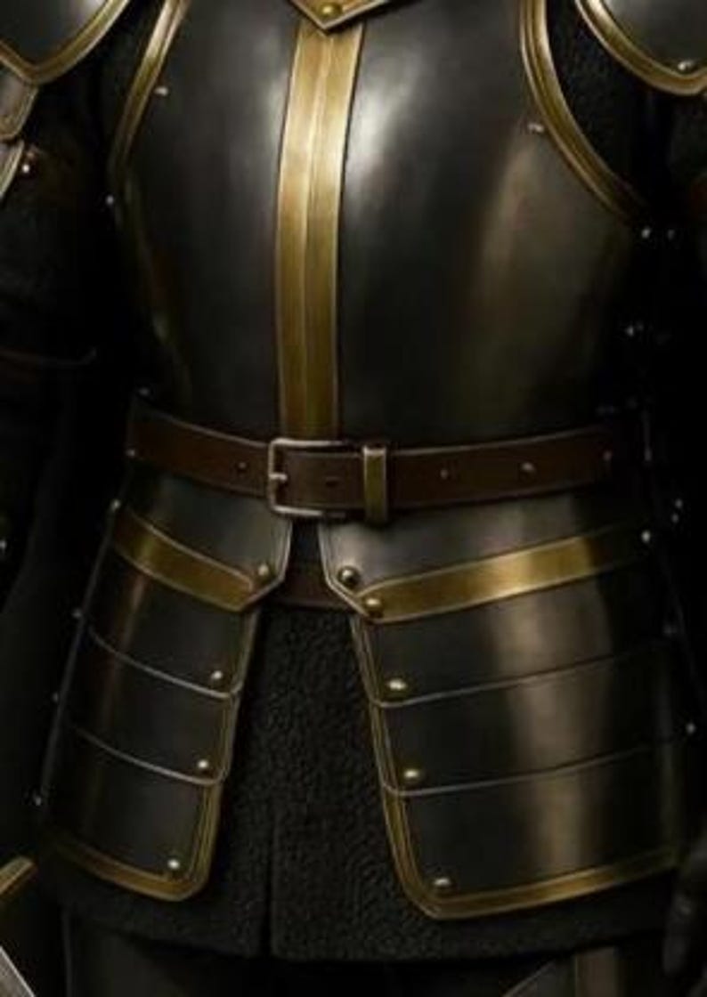May include: Close-up of a medieval-style suit of armor. The armor is primarily black with gold-colored accents and trim. A brown leather belt with a silver buckle is worn around the waist. The armor appears to be made of metal plates.