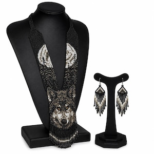 Complete handmade wolf beaded jewelry set featuring a wolf necklace and matching fringe earrings displayed on a clean white background.