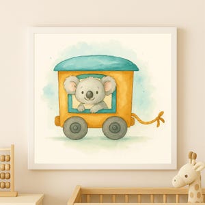 May include: Watercolor illustration of a koala in a yellow train car with a blue roof. The koala is looking out the window. The train has gray wheels and a yellow rope. The artwork is framed in a white square frame.