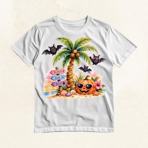 May include: A white t-shirt featuring a colorful graphic of a tropical beach scene with a palm tree, a jack-o'-lantern wearing pink sunglasses, and three bats. A wooden signpost displays the text BEACH, SUN, and BOO! with small icons.