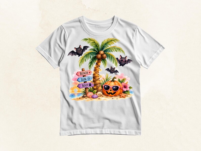 May include: A white t-shirt featuring a colorful graphic of a tropical beach scene with a palm tree, a jack-o'-lantern wearing pink sunglasses, and three bats. A wooden signpost displays the text BEACH, SUN, and BOO! with small icons.