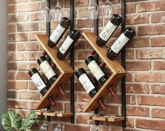 May include: Two wooden wine racks with black metal frames are mounted on a brick wall. Each rack holds wine bottles and has a shelf for wine glasses. The wine bottles are angled for display.