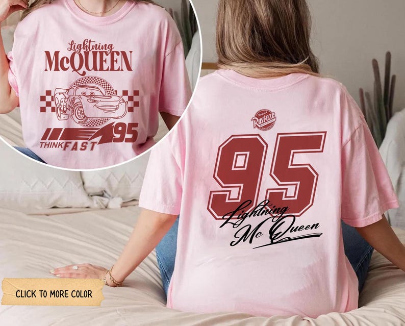 May include: A light pink t-shirt featuring Lightning McQueen graphics. The front displays the character's name, image, and the number 95. The back of the shirt has a large number 95 and the words "Lightning McQueen".