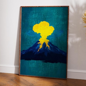 May include: A framed art print featuring a stylized volcano erupting. The artwork depicts a dark blue mountain with a bright yellow eruption against a teal background. The frame is a dark brown color.