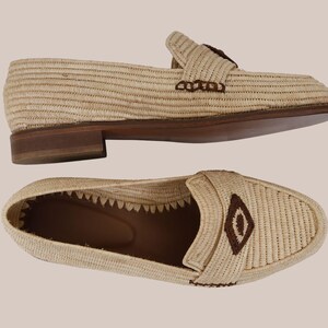 Eco-friendly raffia men’s moccasins on neutral background, artisan Moroccan slip-on loafers