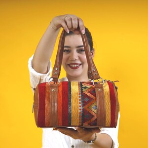 A beautifully unique gift idea for her, presented as a special bohemian leather and kilim handbag.