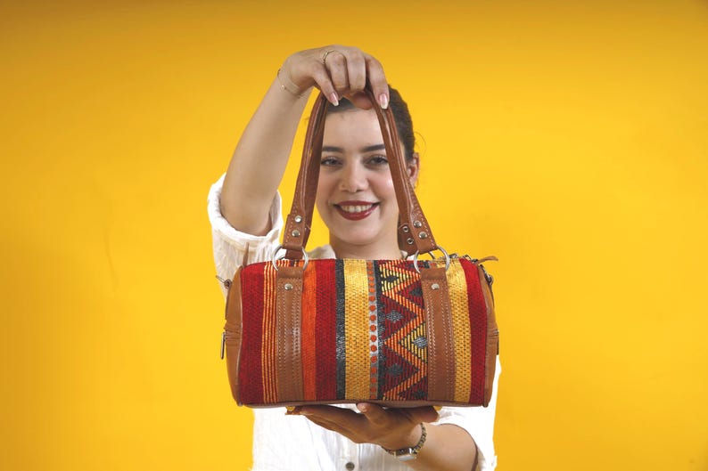 A beautifully unique gift idea for her, presented as a special bohemian leather and kilim handbag.