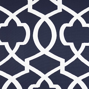 May include: Navy blue fabric with a white geometric pattern. The pattern is a repeating design of interlocking squares and circles.
