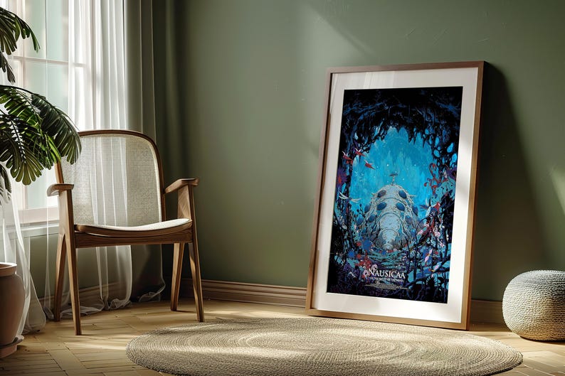 May include: Framed art print featuring a vibrant underwater scene with a large, bioluminescent creature. The artwork, titled "Nausica&auml;", is displayed in a wooden frame, leaning against a green wall. The room includes a wooden chair, a plant, and a round rug.