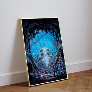 May include: Framed art print featuring a detailed illustration from the animated film "Nausica&auml; of the Valley of the Wind." The artwork showcases a futuristic vehicle in a vibrant blue and black environment, with the film's title at the bottom.