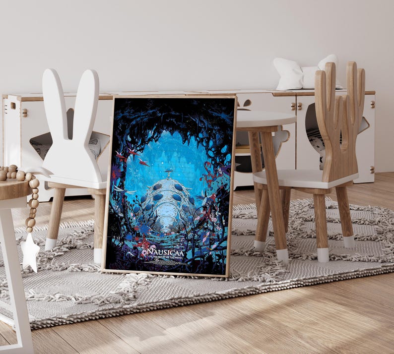 May include: Framed art print featuring a vibrant underwater scene with a large, dome-shaped structure and the text "NAUSICA&Auml;". The artwork is set against a blue background with red and blue accents, creating a fantasy theme.