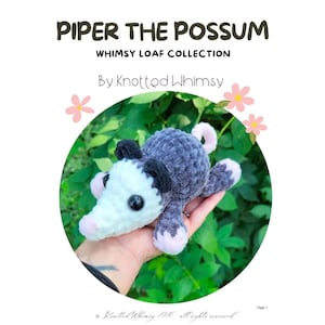 May include: A crochet plush toy of a possum named Piper, featuring a white face, dark gray body, black ears, and pink accents on the nose, feet, and tail. The text reads PIPER THE POSSUM, WHIMSY LOAF COLLECTION, By Knotted Whimsy, and Page 1.
