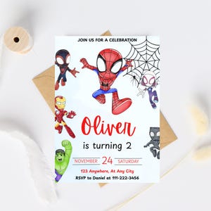 May include: A birthday party invitation featuring several cartoon superheroes, including Spider-Man. The invitation reads "Oliver is turning 2" and includes the date, time, and RSVP information. The design is colorful and playful.