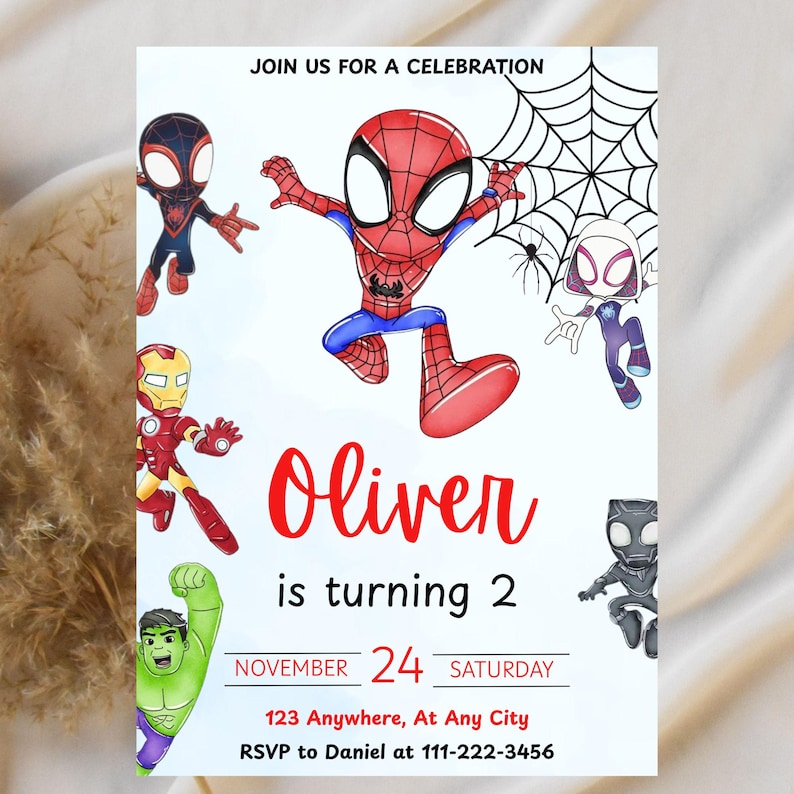 May include: A birthday party invitation featuring several cartoon superheroes, including Spider-Man and Iron Man. The invitation reads "Oliver is turning 2" with the date, time, and RSVP information. The invitation is white with red and blue accents.
