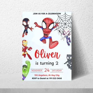 May include: A white invitation card featuring cartoon illustrations of Spider-Man and other superheroes. The text "Oliver is turning 2" is in red, with additional details about the event, including the date, time, and RSVP information.
