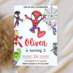 May include: A birthday party invitation featuring various Marvel superheroes, including Spider-Man, Iron Man, and Hulk. The invitation is personalized with the name "Oliver" and the age "2", along with the date, time, and RSVP information.