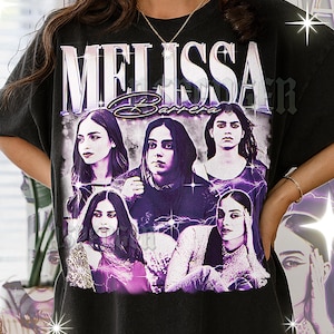 May include: A white ceramic mug with a black handle and the text "But First, Coffee" in a black, bold font. The mug is sitting on a wooden surface. The mug is approximately 4 inches tall.