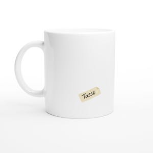 White ceramic mug with label