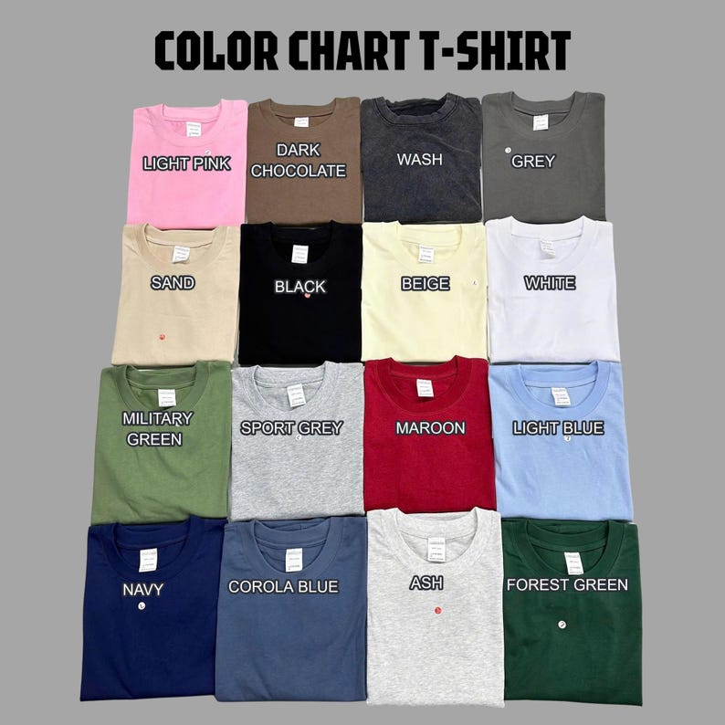 May include: A color chart of t-shirts in various colors, including light pink, dark chocolate, wash, grey, sand, black, beige, white, military green, sport grey, maroon, light blue, navy, corola blue, ash, and forest green. Each shirt has a small button.