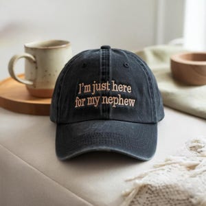 May include: A set of three ceramic mugs with a speckled, matte finish. The mugs are in shades of cream, light gray, and dark gray. Each mug has a simple, minimalist design, perfect for coffee or tea.