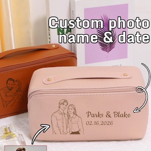 May include: A light pink cosmetic bag with a handle, featuring a custom engraved photo, names, and date. The text "Custom photo name & date" is displayed above the bag. Additional bags in brown, black, and white are also shown.