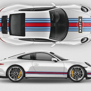 May include: A white sports car with blue and red racing stripes and the word "MARTINI" on the hood. The car is shown from a top-down and side view. The wheels are gray with yellow brake calipers.