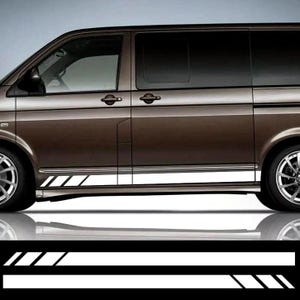 May include: A brown van with white accent stripes along the side. The van has black tinted windows and silver wheels. The stripes are angled and parallel, creating a sporty look.