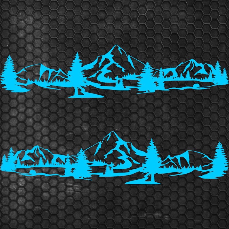 May include: Two identical blue mountain and forest decals. Each decal features a mountain range, trees, and a lake or river. The decals are designed to be applied to a vehicle or other surface. The background is a dark gray, textured surface.
