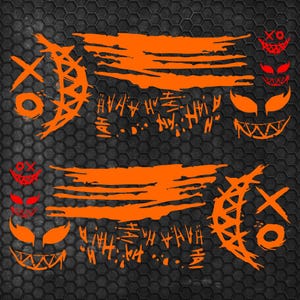 May include: A set of orange vinyl decals featuring two large crescent moon shapes with XO markings, two horizontal brushstroke patterns, and several smaller grinning face icons with sharp teeth and the repeated text HAHA.