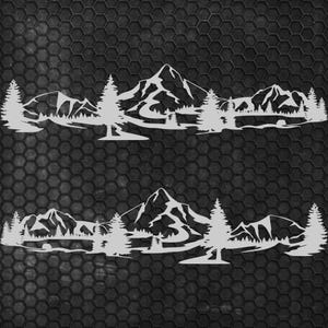 May include: Two identical white mountain and forest silhouette decals. Each decal features a mountain range, trees, and a lake. The decals are displayed against a dark, textured background.