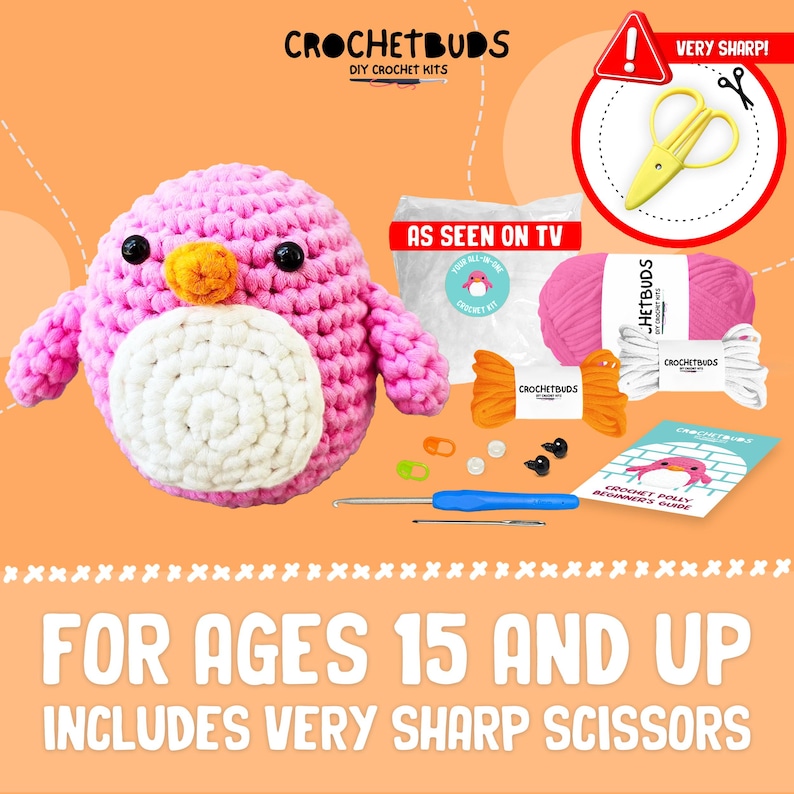 May include: A DIY crochet kit featuring a pink penguin with a white belly and orange beak. The kit includes pink yarn, a crochet hook, safety eyes, and a beginner's guide. The text reads "CROCHETBUDS" and "FOR AGES 15 AND UP".