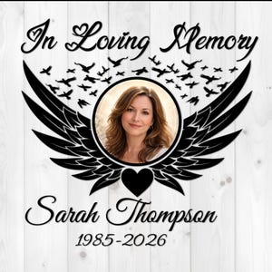 May include: Memorial plaque with the words "In Loving Memory" and "Sarah Thompson 1985-2026". The design includes a photo of a woman, wings, a heart, and flying birds, all in black against a white wood background.
