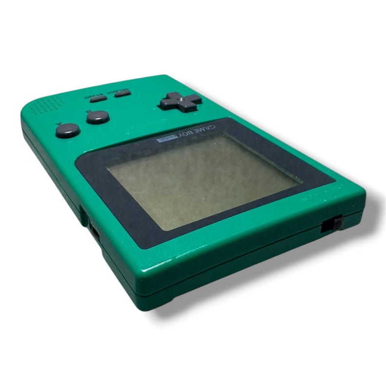 May include: A handheld video game console in a bright green plastic casing with a black screen border. It features a dark gray directional pad, two round action buttons labeled A and B, and two smaller rectangular buttons labeled Select and Start.