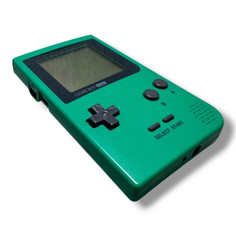 May include: A green handheld video game console with a black screen border, a gray directional pad, two gray action buttons labeled A and B, and two gray buttons labeled SELECT and START. The text GAME BOY pocket is printed below the screen.