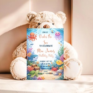 May include: A birthday party invitation with an underwater theme. The invitation features illustrations of sea creatures like an octopus, shark, and jellyfish. The text reads "Under the Sea to Celebrate Mia James Birthday Party."