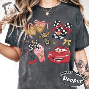 May include: A set of three ceramic mugs with a speckled, matte finish. Each mug features a different color: light blue, cream, and gray. The mugs have a simple, modern design and a comfortable handle.