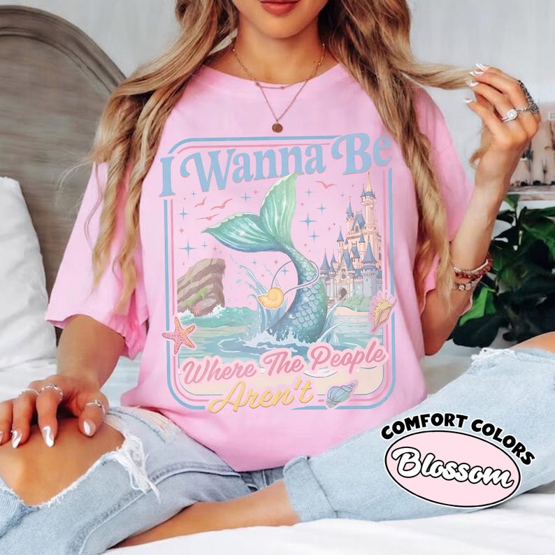 May include: A white ceramic mug with a black handle and the text "But First, Coffee" in a black, handwritten-style font. The mug is on a white surface.