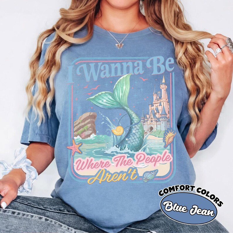 May include: A white ceramic mug with a black handle and the text "But First, Coffee" in a black, bold font. The mug is sitting on a wooden surface. The mug is approximately 4 inches tall.