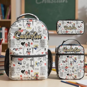 May include: A white backpack, lunch bag, and pencil case set featuring a repeating pattern of Mickey Mouse illustrations, hearts, and text. The name "Christian" is written in gold script on each item. The backpack has black mesh side pockets.